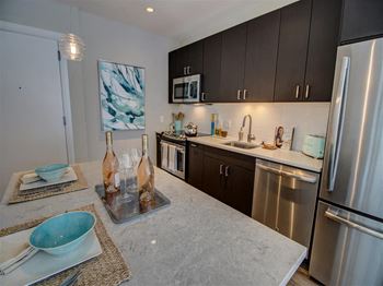 Fitted kitchen with island dining